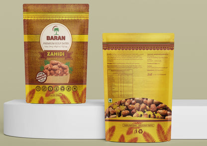 Two Baran Zahidi spice packets on a white platform with a light green background